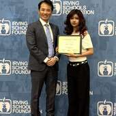 Sung Won, MD presenting a scholarship to recipient Sofie Magaña